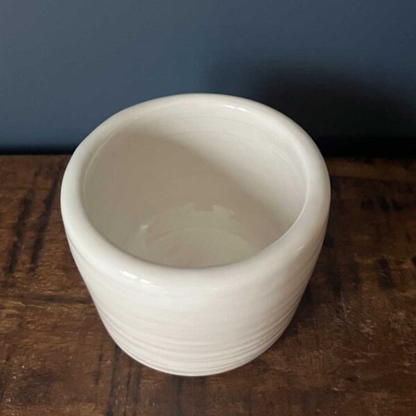 small white glazed pot