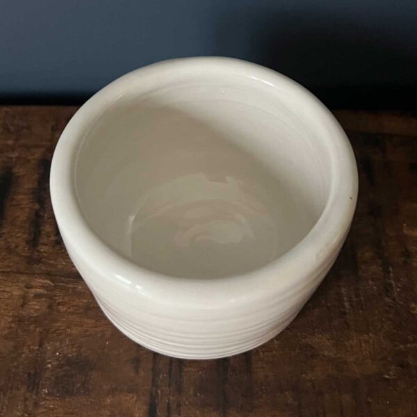 small white glazed pot
