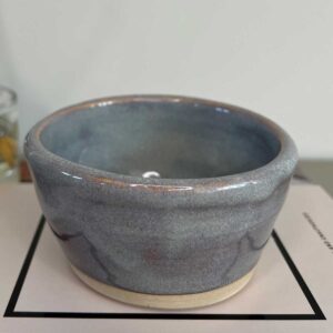 blue grey ceramic pot with reddish undertones