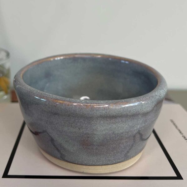 blue grey ceramic pot with reddish undertones