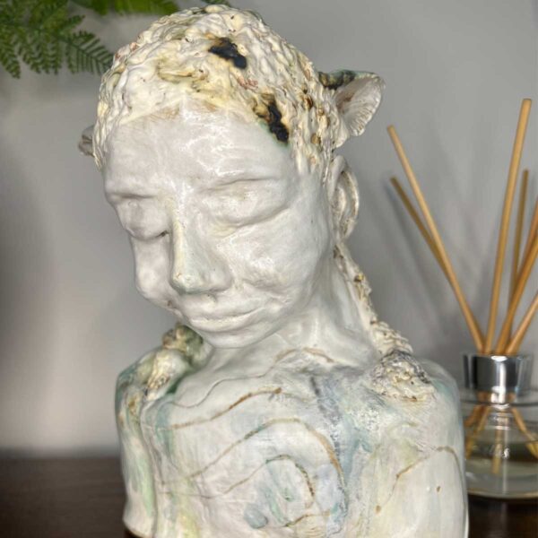 ceramic lamb human sculpture representing spring