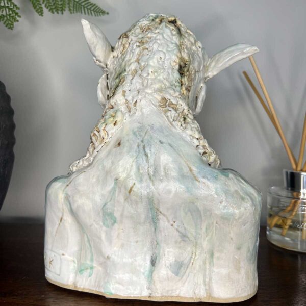 ceramic lamb human sculpture representing spring - reverse side